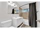 Clean bathroom with a bathtub, vanity, and updated fixtures at 6205 Hargrove Ave, Las Vegas, NV 89107