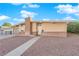 Ranch-style home with brick facade and attached garage at 6205 Hargrove Ave, Las Vegas, NV 89107