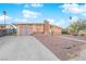 Ranch style home with brick facade and attached garage at 6205 Hargrove Ave, Las Vegas, NV 89107