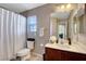 Clean bathroom with a shower/tub combo and vanity at 651 Penshaw Bridge Ave, Las Vegas, NV 89178