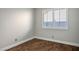 Simple bedroom with wood-look floors and window shutters at 7528 Pinto Bluff St, Las Vegas, NV 89131