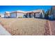 Single-story house with front yard and two-car garage at 7528 Pinto Bluff St, Las Vegas, NV 89131