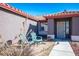 Small front patio with seating and desert plants at 7528 Pinto Bluff St, Las Vegas, NV 89131