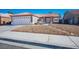 Single story home with attached garage and desert landscaping at 7528 Pinto Bluff St, Las Vegas, NV 89131