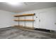 Garage with storage shelving and access door at 7528 Pinto Bluff St, Las Vegas, NV 89131