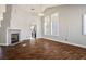 Spacious living room featuring hardwood floors and a fireplace at 7528 Pinto Bluff St, Las Vegas, NV 89131