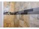 Shower with tile surround and modern fixtures at 7528 Pinto Bluff St, Las Vegas, NV 89131