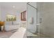 Luxurious bathroom with a soaking tub, glass shower, and modern fixtures at 1303 S 8Th St, Las Vegas, NV 89104