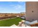 Artificial turf backyard with pergola, seating, and scenic views at 8606 Dusty Quail Dr, Las Vegas, NV 89148