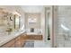 Spa-like bathroom with soaking tub, walk-in shower, and hexagon tile flooring at 8606 Dusty Quail Dr, Las Vegas, NV 89148