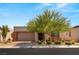 Single-story home with desert landscaping and two-car garage at 8606 Dusty Quail Dr, Las Vegas, NV 89148