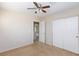 Bedroom with double door closet and ceiling fan at 8789 Ashley Park Ave, Las Vegas, NV 89148