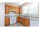 Kitchen area with wood cabinets and sink at 8789 Ashley Park Ave, Las Vegas, NV 89148