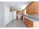 Kitchen with wood cabinets and tile floor at 8789 Ashley Park Ave, Las Vegas, NV 89148