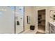 Bathroom with a large walk-in shower, built-in bench, and spacious closet at 9268 Copernicus Ave, Las Vegas, NV 89143