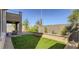 Private backyard with patio, artificial turf, and fire pit at 9280 Copernicus Ave, Las Vegas, NV 89143