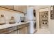 Laundry room with stacked washer and dryer, and built-in shelving at 9280 Copernicus Ave, Las Vegas, NV 89143