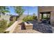 Relaxing patio area with seating and fire pit, offering mountain views at 9280 Copernicus Ave, Las Vegas, NV 89143