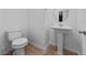 Small bathroom with pedestal sink and toilet at 965 Nevada State Dr # 15103, Henderson, NV 89002