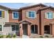 Modern townhome featuring a welcoming front entrance and landscaping at 965 Nevada State Dr # 15103, Henderson, NV 89002