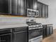 Modern kitchen features stainless steel appliances and dark wood cabinets at 965 Nevada State Dr # 15103, Henderson, NV 89002