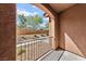 Private patio with wrought iron railing, offering a view of the community at 965 Nevada State Dr # 15103, Henderson, NV 89002