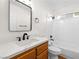 Updated bathroom with wood vanity, quartz countertop, and modern fixtures at 9741 Horizon Hills Dr, Las Vegas, NV 89117