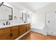 Elegant bathroom with double vanity, quartz countertops, and a soaking tub at 9741 Horizon Hills Dr, Las Vegas, NV 89117