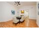 Sunlit dining room features hardwood floors, vaulted ceilings, and stylish furnishings at 9741 Horizon Hills Dr, Las Vegas, NV 89117