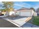 Single-story house with a two-car garage and neatly landscaped front yard at 9741 Horizon Hills Dr, Las Vegas, NV 89117