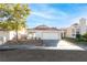 Single-story house with a two-car garage and well-maintained landscaping at 9741 Horizon Hills Dr, Las Vegas, NV 89117