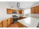 Modern kitchen with wood cabinets, quartz countertops, and stainless steel appliances at 9741 Horizon Hills Dr, Las Vegas, NV 89117