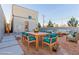 Outdoor patio furniture and dining set in a gravel backyard at 816 Franklin Ave, Las Vegas, NV 89104