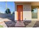 Backyard access with orange door and flagstone pathway at 816 Franklin Ave, Las Vegas, NV 89104