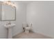 Clean and modern bathroom with pedestal sink and tiled floors at 1303 S 8Th St, Las Vegas, NV 89104