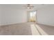 Spacious bedroom with ceiling fan and access to private balcony at 816 Franklin Ave, Las Vegas, NV 89104