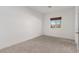 Simple bedroom with carpet and a window offering an outside view at 816 Franklin Ave, Las Vegas, NV 89104