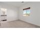 Spacious bedroom with adjacent bathroom access and window at 1303 S 8Th St, Las Vegas, NV 89104