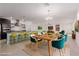 Open concept dining area with wood table and chairs, adjacent to kitchen at 1303 S 8Th St, Las Vegas, NV 89104