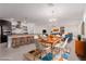 Open concept dining area with wood table and chairs, adjacent to kitchen at 1303 S 8Th St, Las Vegas, NV 89104