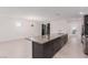 Modern kitchen with dark cabinetry, island, and stainless steel appliances at 816 Franklin Ave, Las Vegas, NV 89104