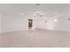 Bright and airy living room with neutral tile floor and ceiling fan at 816 Franklin Ave, Las Vegas, NV 89104