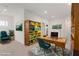 Bright home office with mid-century modern furniture and bookcases at 1303 S 8Th St, Las Vegas, NV 89104