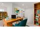 Modern home office with a desk, chair, and built-in shelving at 1303 S 8Th St, Las Vegas, NV 89104