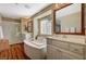 Elegant bathroom with double sinks, a large soaking tub, and a walk-in shower at 1032 Campo Seco Ct, Las Vegas, NV 89138