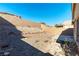 Spacious backyard with gravel and a patio at 10957 Civiletti St, Las Vegas, NV 89141