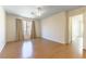 Bright bedroom featuring wood floors and window with curtains at 10957 Civiletti St, Las Vegas, NV 89141