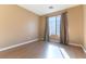 Bright bedroom with wood floors and large window at 10957 Civiletti St, Las Vegas, NV 89141
