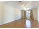 Spacious bedroom with ceiling fan and wood floors at 10957 Civiletti St, Las Vegas, NV 89141