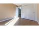 Spacious bedroom featuring wood floors and double doors to closet at 10957 Civiletti St, Las Vegas, NV 89141